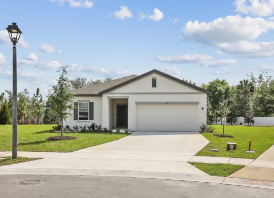 a house with a street light in front of it at Beacon at Woodland Village, DeLand, 32724