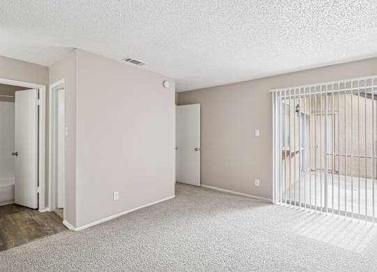 B6 room with a white carpet and a white gate.