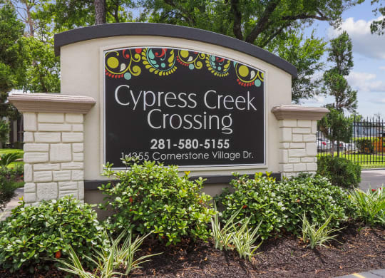 a sign at the entrance of cypress creek crossing