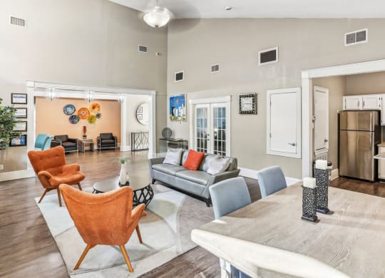 Leasing office lounge area with couch and chairs at Hunters Chase in Austin, TX
