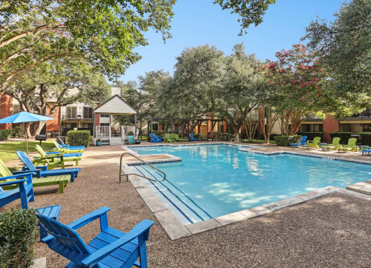 Pool with steps going into water at Hunters Chase in Austin, TX