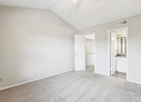 A3 floor plan bedroom with vaulted ceiling and private bathroom entrance at Jefferson Creek Apartments in Irving, TX.