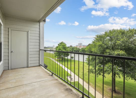 A2 floor plan balcony overlooking Hackberry Creek at Jefferson Creek Apartments in Irving, TX.