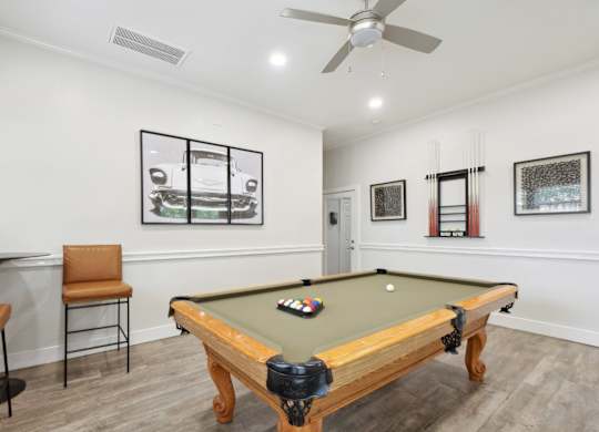 A pool table in the resident lounge at Jefferson Place Apartments in Irving, TX