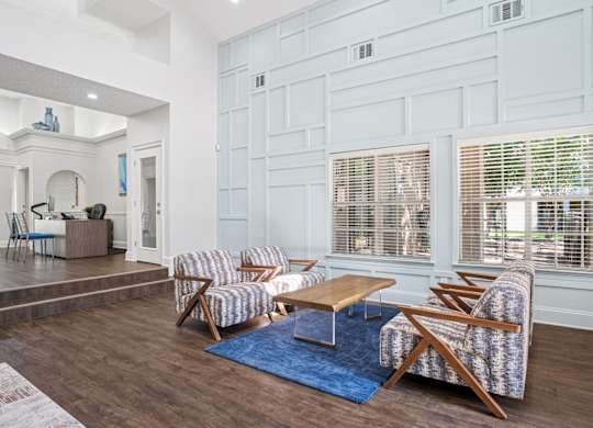 Clubhouse area in leasing office with seating and a coffee table.