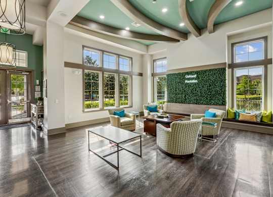 A spacious living room with a glass table and chairs.