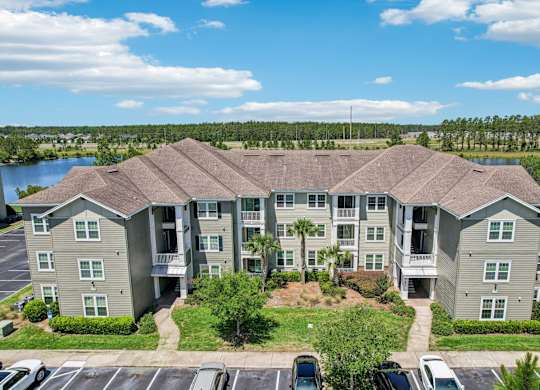 Front view of our apartment buildings in the daytime at Oakleaf Plantation apartments in Jacksonville, FL