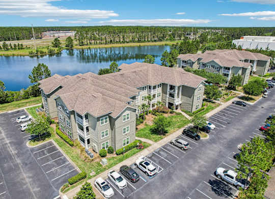 A large building with a parking lot in front of it.