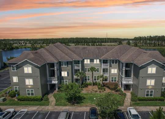 Front view of our apartment buildings at dusk in Oakleaf Plantation apartments in Jacksonville, FL