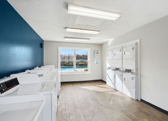 laundry room 
at Sabal Point Apartments in Pineville, NC