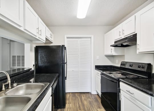 a kitchen 
at Sabal Point Apartments in Pineville, NC