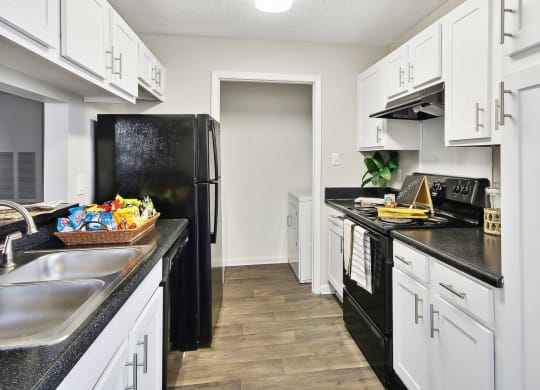 a kitchen 
at Sabal Point Apartments in Pineville, NC