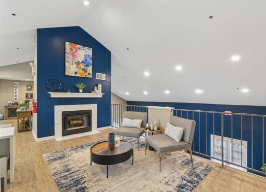 Lounge area near the Leasing Office with fireplace at Woodmere Trace at Duluth, GA