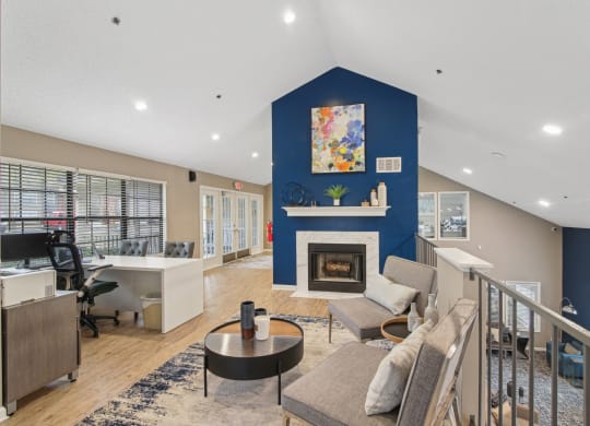 Leasing Office with lounge seating at fireplace at Woodmere Trace at Duluth, GA