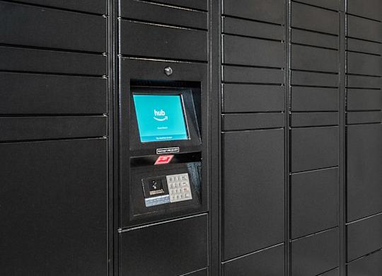 A black panel with a screen and buttons on it.