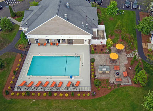 A large house with a pool in the backyard.
