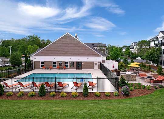 A house with a pool in the backyard.
