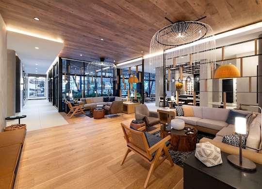A modern living room with wooden floors and furniture.