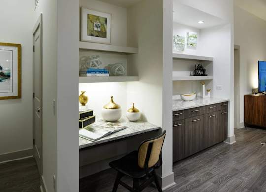 A modern kitchen with a dining table and chairs.