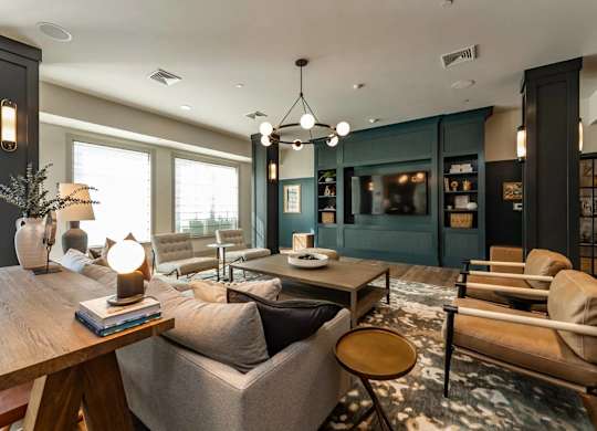 A modern living room with a wooden coffee table and grey sofa.