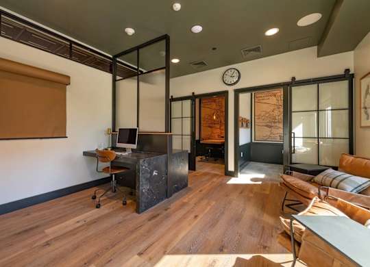 A room with a wooden floor and a glass wall.