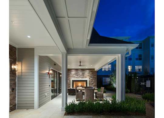 A modern house with a patio and a fireplace.