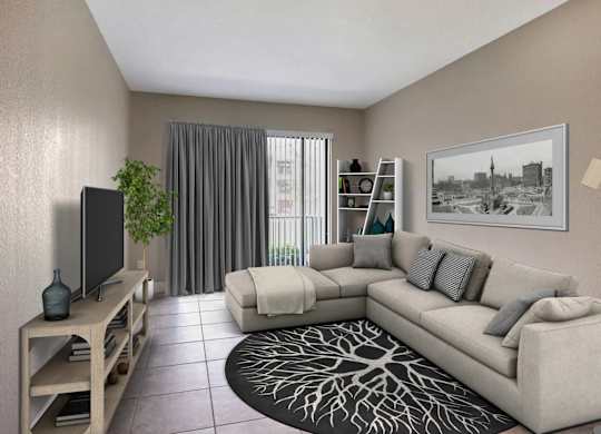 A living room with a grey couch, a television, a plant, and a framed picture on the wall.
