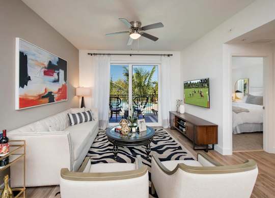 A living room with a zebra rug and a painting on the wall.