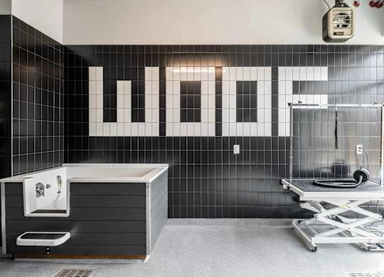 A bathroom with a WOFF sign on the wall.