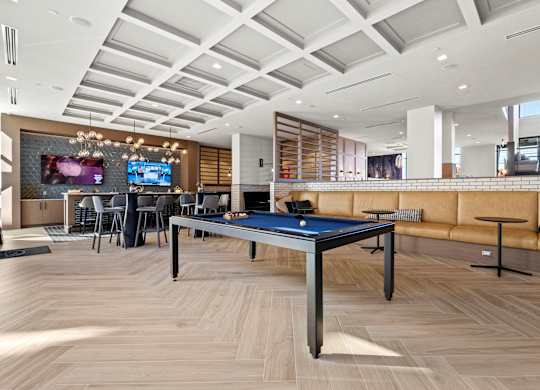 A room with a blue table in the middle of it.