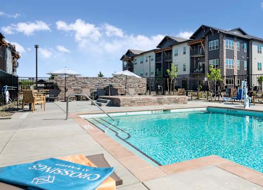 A pool with a blue cover that says