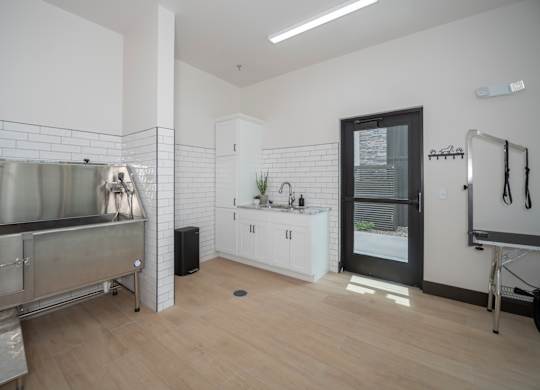 A kitchen area with a sink and a bicycle.
