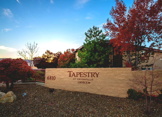 a sign at the entrance of tapestry