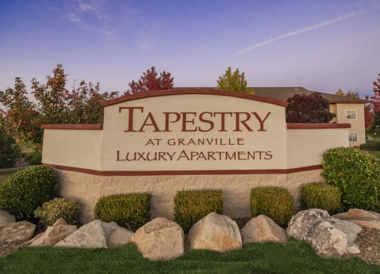 a sign for tapestry luxury apartments