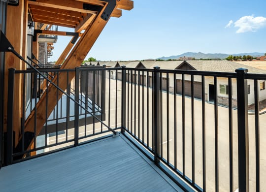 a view of the balcony of a house with a balcony fence at The Crossings  at Windsong, Arizona, 86314