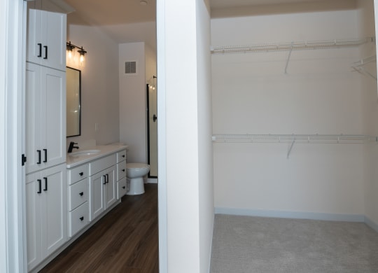 a view of a bathroom with a shower and sink and a toilet at The Crossings  at Windsong, Prescott Valley, 86314