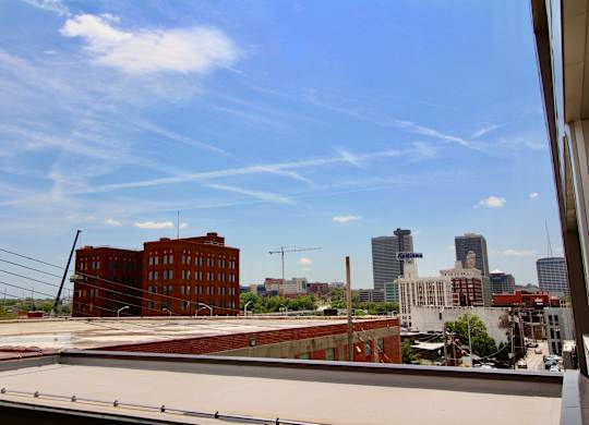 A view of a cityscape from a rooftop.
