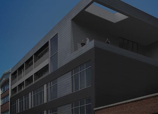 A modern building with a flat roof and large windows.