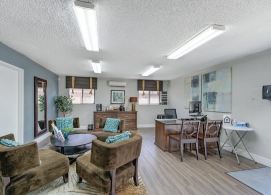 Asbury Place Apartments leasing office with lounge chairs and management desks