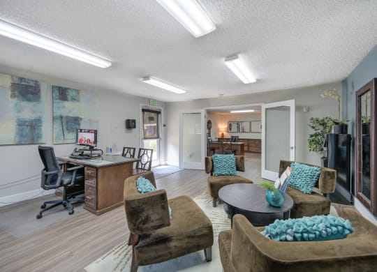 Asbury Place Apartments leasing office with lounge chairs and management desks