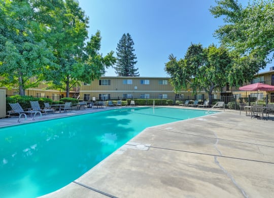 Asbury Place Apartments swimming pool area with lounge seating.
