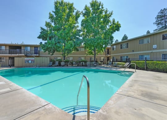 Asbury Place Apartments swimming pool area with lounge seating.