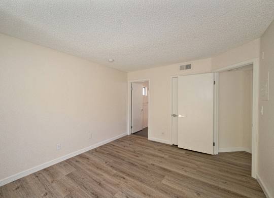 Apartment home bedroom with closet at Croft Plaza Apartments, California