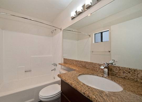 a bathroom with a bathtub and a sink at Croft Plaza Apartments, West Hollywood