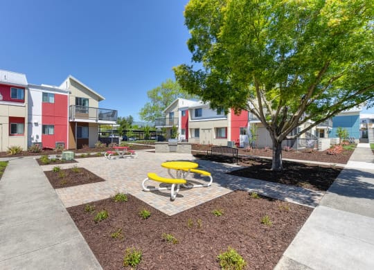 Outdoor Lounge Space Walking Path, Wood Chip Floor, Picnic Tables at Addison Ranch Apartments, Petaluma