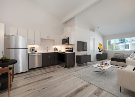 a living room with a couch and a table  at Track 281 Apartments, California
