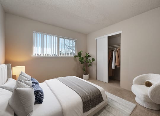 a bedroom with a bed and a closet