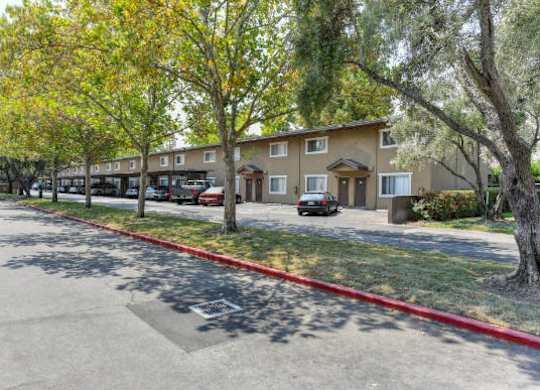 Community Exterior with Street, Grass and Trees  at Olympus Park Apartments, Roseville, CA, 95661