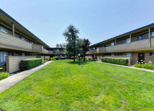 Community Outdoor Green Space and Apartment Exteriors  at Olympus Park Apartments, California