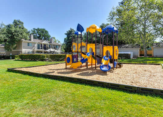 Playground with Sand, Grass at Hidden Oaks Apartments, California, 95621